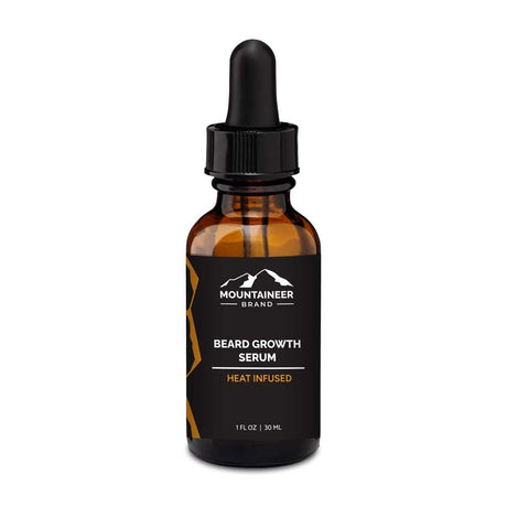 A bottle of Mountaineer Brand Products' Heat Infused Beard Growth Serum on a white background.