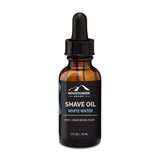 A bottle of all-natural Mountaineer Brand Products Pre-Shave Oil on a white background.