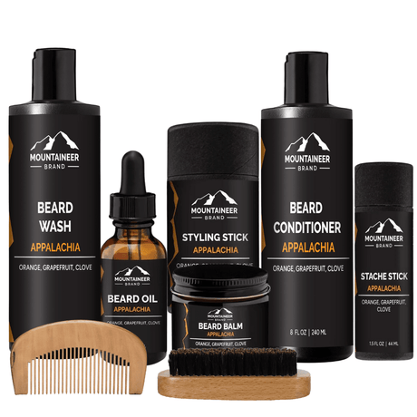 A comprehensive beard care kit, The Ultimate Beard Kit by Mountaineer Brand Products, featuring a beard brush and comb, providing grooming solutions for all your facial hair needs.