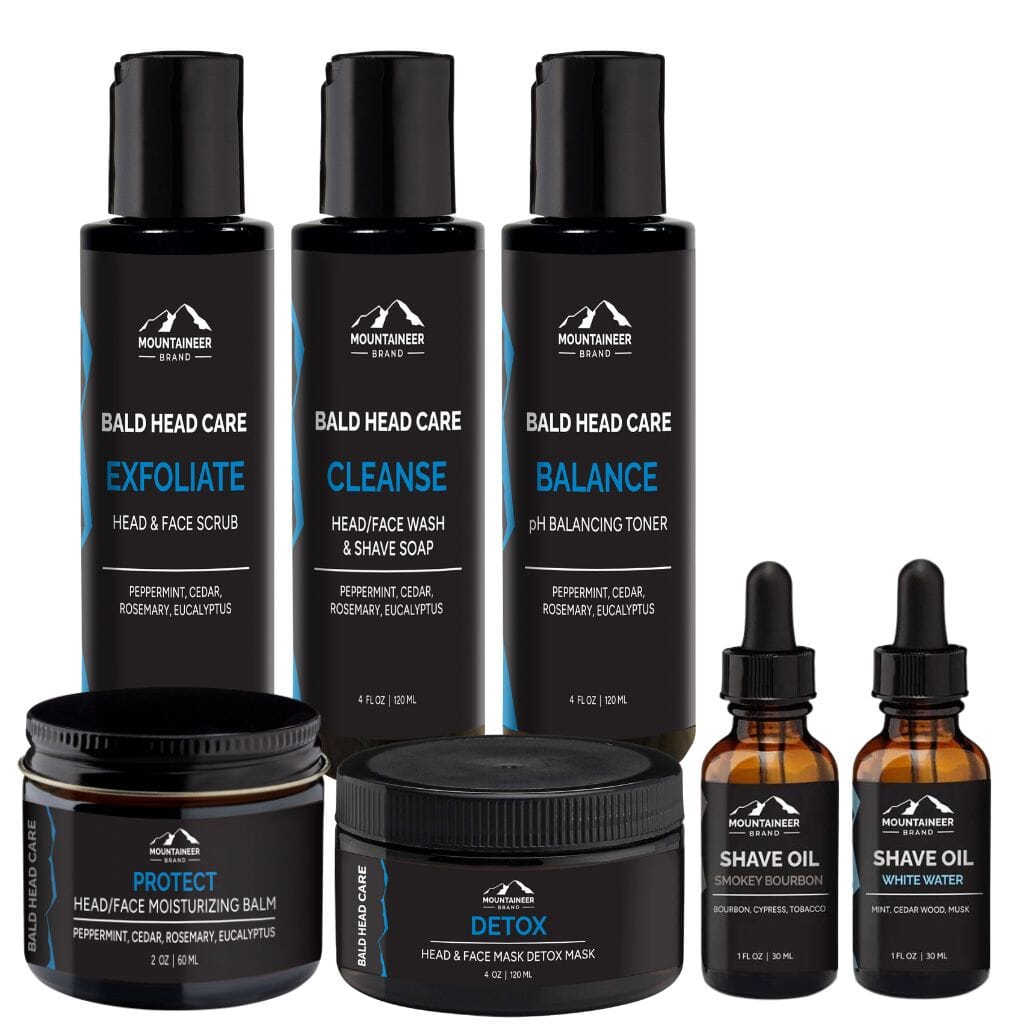 The Mountaineer Brand Products Complete Bald Head Care System + 2 Free Shave Oils is shown on a white background, highlighting its shine and effectiveness in combating dryness.