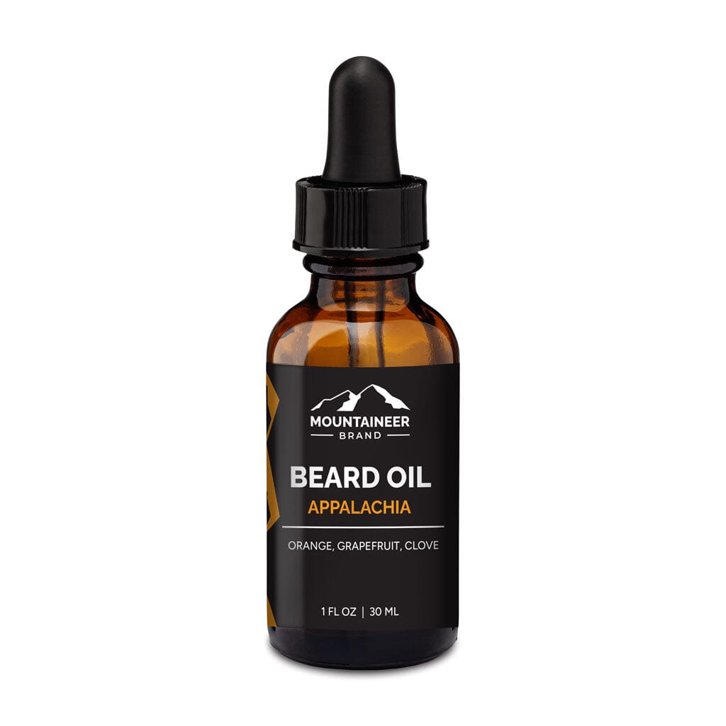 Amber glass bottle with dropper containing Mountaineer Brand Products Natural Beard Oil labeled "Appalachia" with orange and grapefruit scent, enhanced with natural oils, 1 fl oz/30 ml.