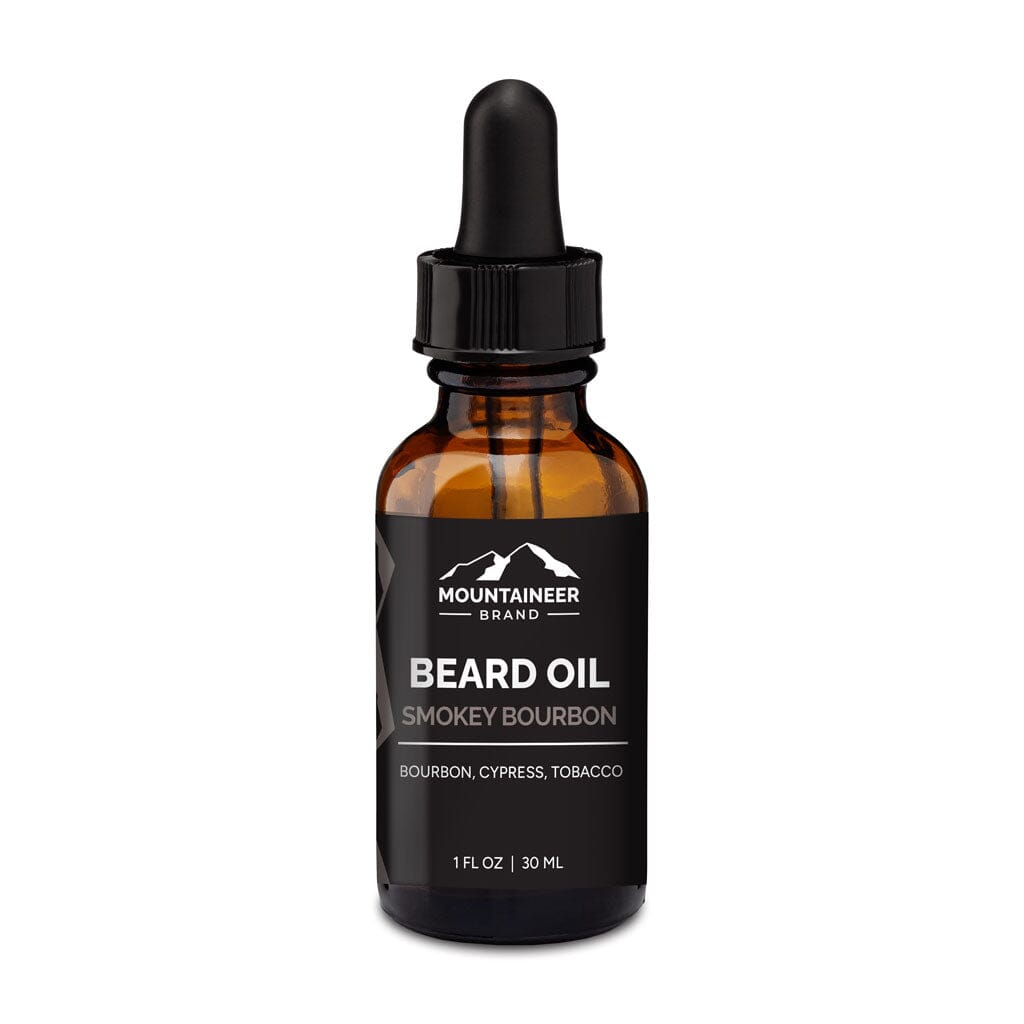A bottle of Mountaineer Brand Products Natural Beard Oil labeled "Smokey Bourbon" with bourbon, cypress, and tobacco notes, 30 ml size, with a dropper cap.