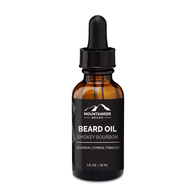 An organic bottle of Mountaineer Brand Products Smokey Bourbon Beard Oil on a white background.