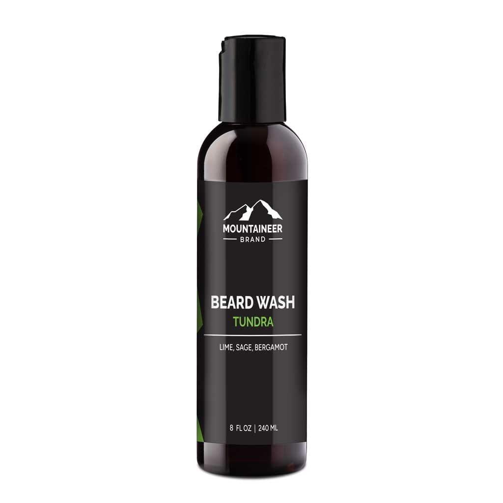 A bottle of Mountaineer Brand Products Beard Wash labeled "tundra" with lime, sage, and bergamot scents, containing 8 fl oz (240 ml) and formulated with natural ingredients.