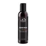 Bottle of Mountaineer Brand Products Natural Beard Wash/Shampoo with pine tar scent, formulated with natural ingredients and displaying the product details on its label.