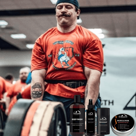 A weightlifter preparing for a lift, surrounded by their Mountaineer Brand Products gym bag kit.