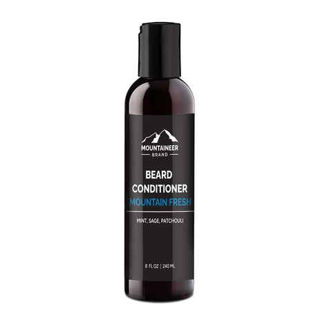 A bottle of Mountaineer Brand Products Natural Beard Conditioner labeled "mountain fresh" with mint, sage, and patchouli, designed for natural conditioning, against a white background.