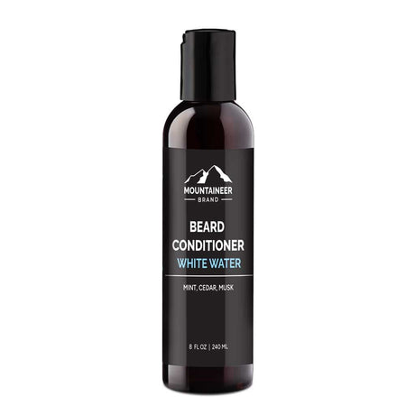 A black bottle of Mountaineer Brand Products Natural Beard Conditioner labeled "White Water" with scent notes of mint, cedar, and musk, 8 fl oz size.