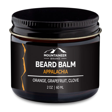 A jar of Mountaineer Brand Products Natural Beard Balm, labeled "Appalachia" with natural essential oils of orange, grapefruit, and clove, in a 2 oz container.