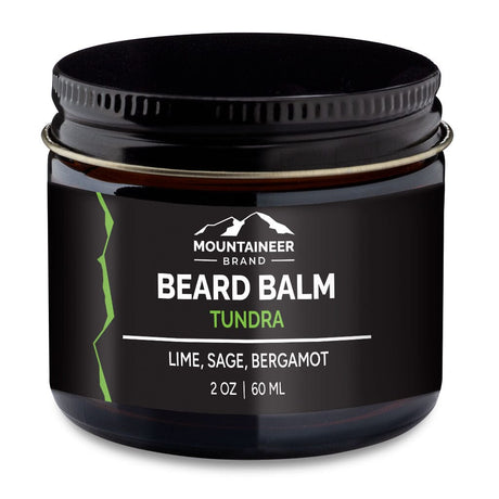 A jar of Mountaineer Brand Products beard balm labeled "tundra" with lime, sage, and bergamot scents, 2 oz or 60 ml size, on a white background