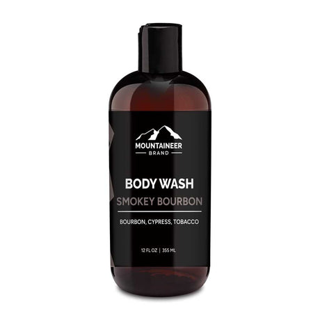 A bottle of Mountaineer Brand Products natural men's body wash labeled "smokey bourbon" with scents of bourbon, cypress, and tobacco, presented on a white background.