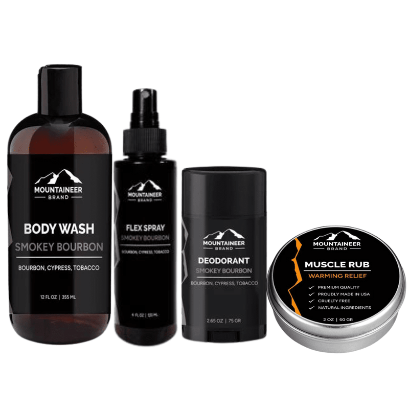 Assorted grooming products from Mountaineer Brand Products featuring the Gym Bag Kit with body wash, deodorant, spray, and muscle rub with a smokey bourbon scent perfect for your post-workout routine.