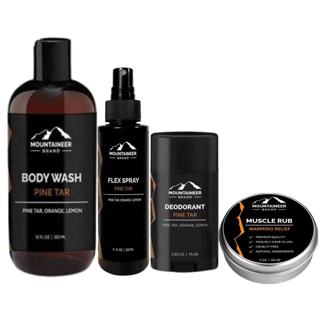 A Gym Bag Kit of Mountaineer Brand Products grooming products for a post-workout routine, including body wash, flex spray, deodorant, and muscle rub with pine tar, orange, and lemon scents.