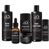A comprehensive beard care kit offering a grooming experience with The Big Beard Kit from Mountaineer Brand Products, including a bottle of beard oil, beard shampoo, and beard conditioner.