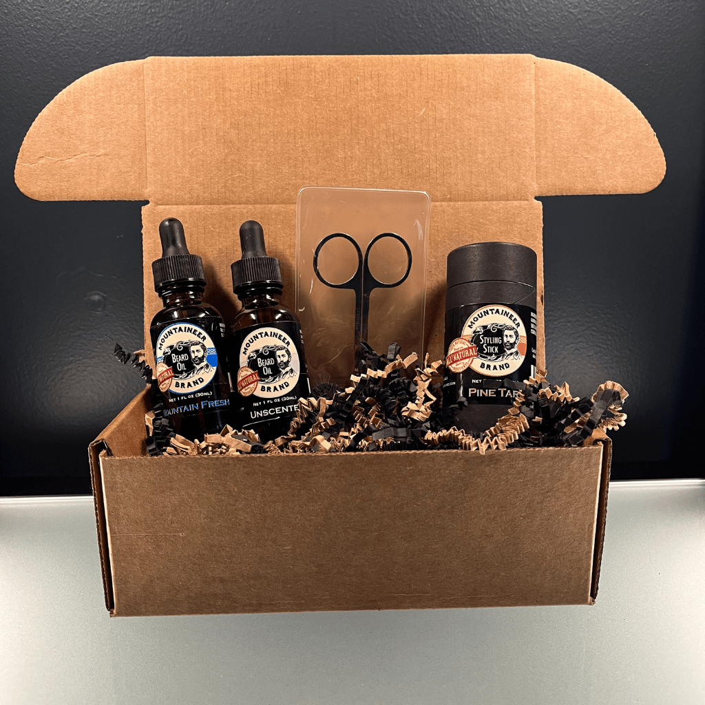 A box containing the Limited Time Style & Trim Kit by Mountaineer Brand Products, which includes Pine Tar beard oil and a pair of scissors.