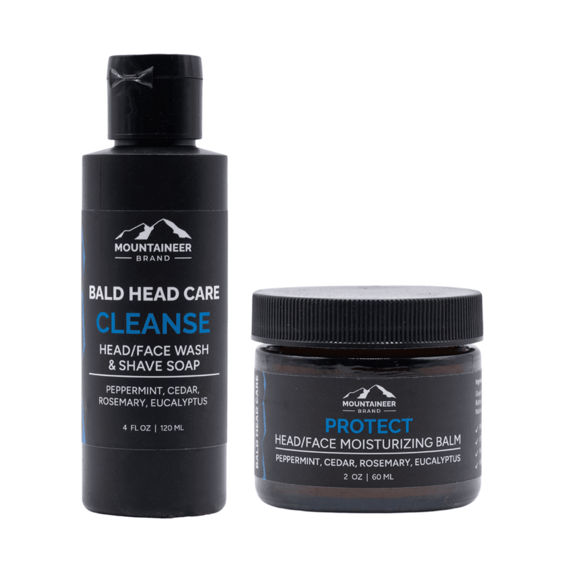 Two Mountaineer Brand Products grooming products for bald head care: a black soap dispenser labeled "cleanse" and a small jar labeled "protect" moisturizing balm.