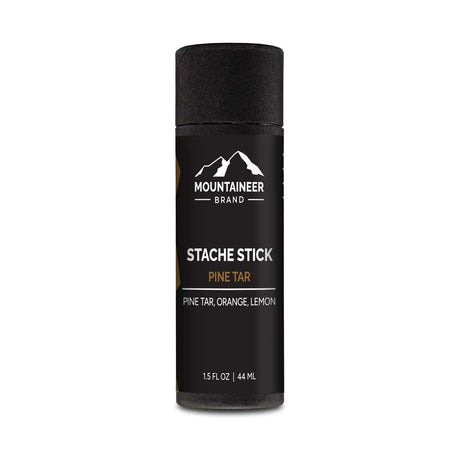 An organic Mountaineer Brand Products Pine Tar Stache Stick on a white background.