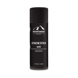 An organic Mountaineer Brand Products Mustache Wax - 9 Scents Available stick bare on a white background.