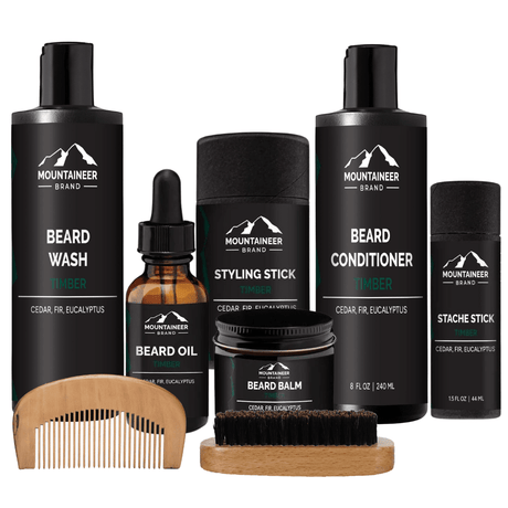 A grooming kit, The Ultimate Beard Kit from Mountaineer Brand Products, that includes a beard brush, beard oil, and comb for comprehensive beard care in your grooming routine.