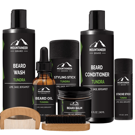 A comprehensive The Ultimate Beard Kit from Mountaineer Brand Products, with a beard brush and beard oil, providing all-in-one grooming solutions.