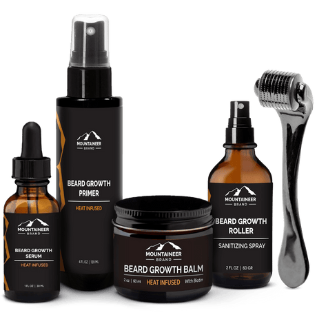A collection of Mountaineer Brand Products' men's beard grooming products, including growth oil, primer, balm, sanitizing spray, and a roller.