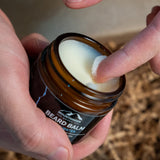 Mountaineer Brand Products' Best Sellers Kit in a jar with a hand holding it.