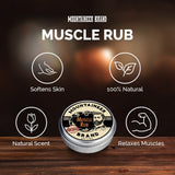 A tin of all natural Mountaineer Brand Products' muscle rub on a wooden table.