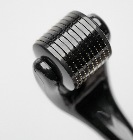 A close up of a Mountaineer Brand Products Titanium Beard Growth Roller.