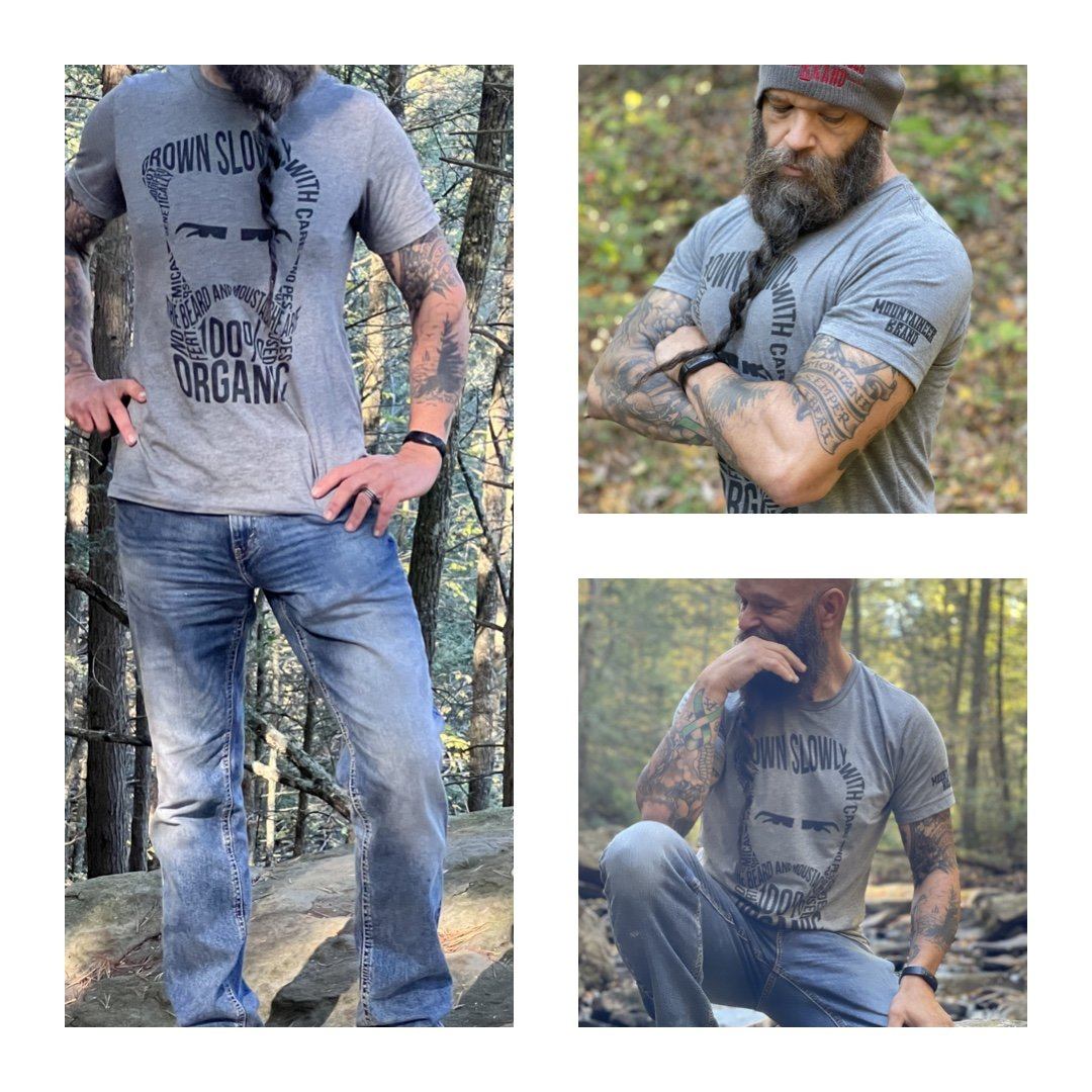 An all-natural man with a beard wearing a Mountaineer Brand Products 100% Organic Beard Man T-Shirt.