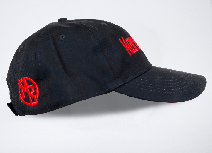 A black hat with the Mountaineer Brand Logo Style Adjustable Ball Cap on it.